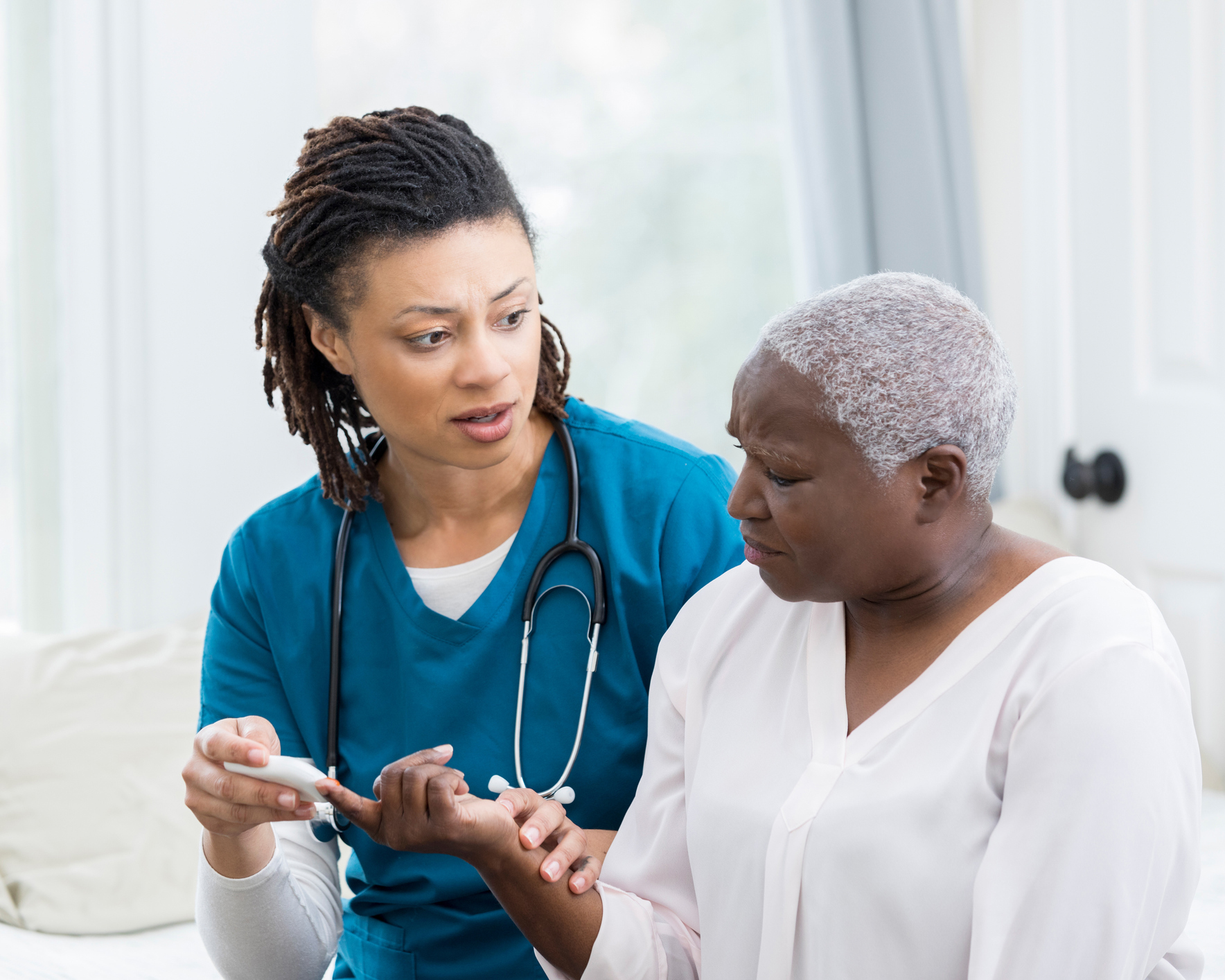 iStock diabetic woman getting help from nurse