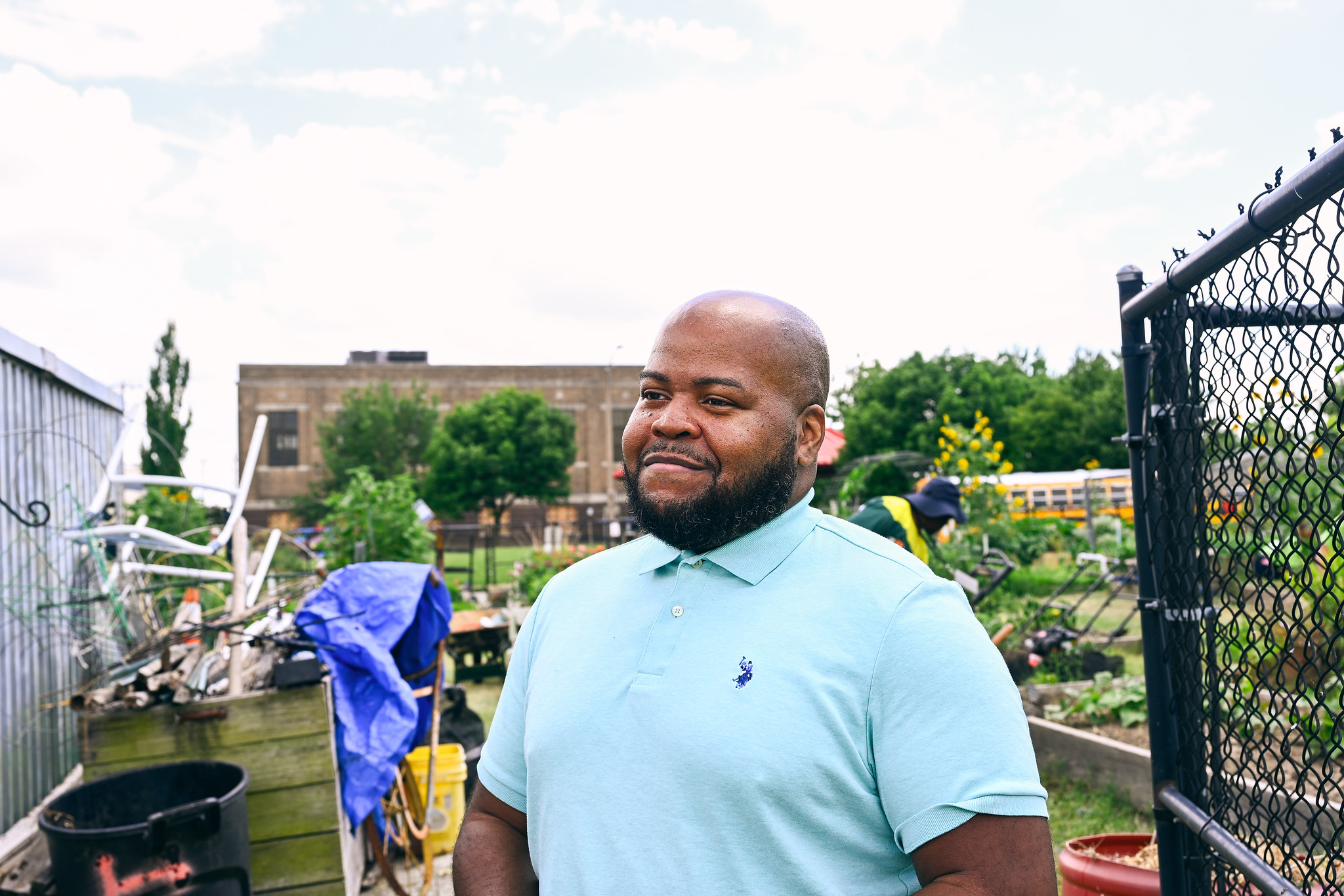 Byron Wright, youth director for the Central States Conference, visits Fresh Starts Community Garden to observe the young volunteers in action.