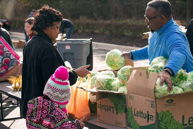 handing out lettuce