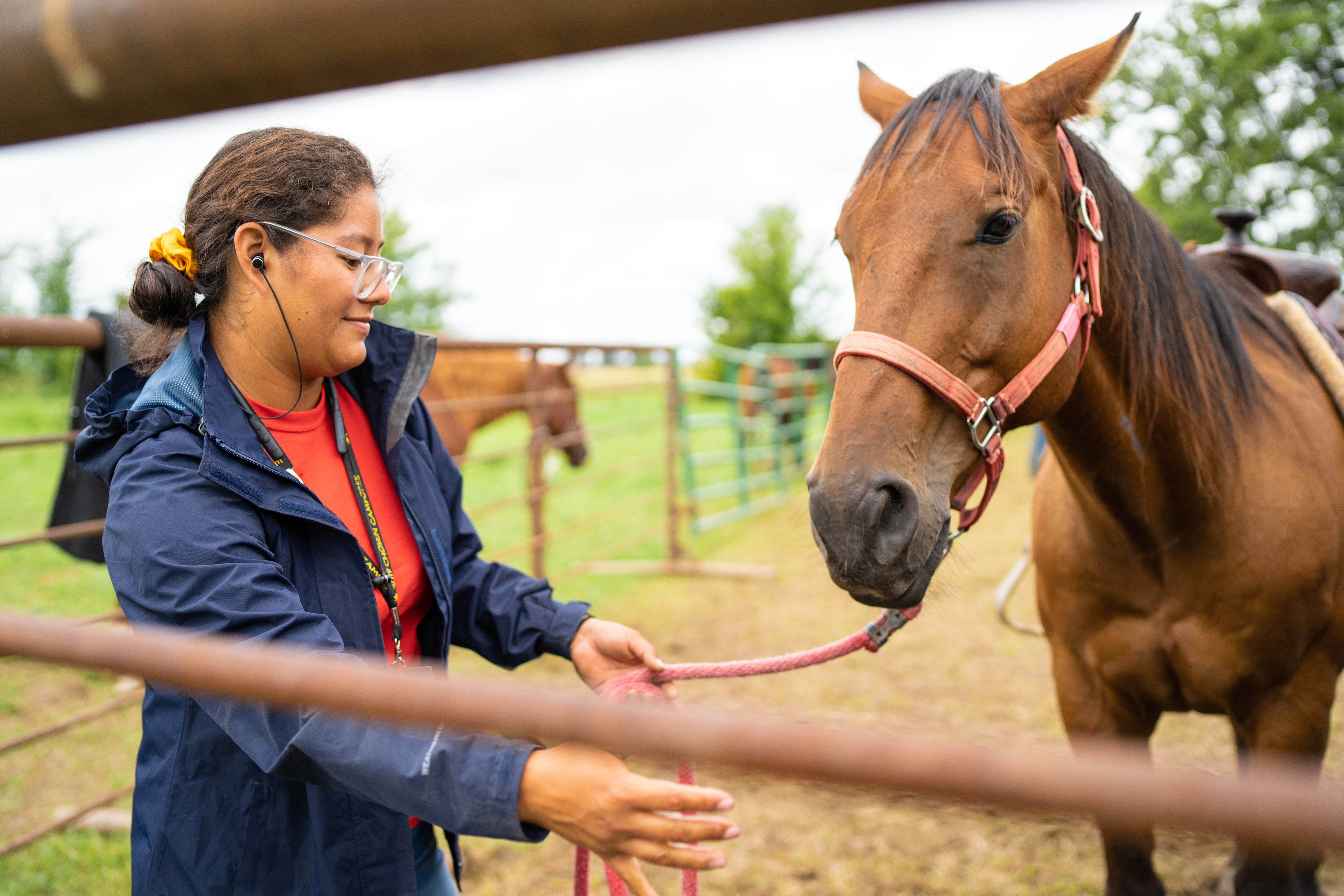 oshkosh 2019 Flor Dominguez of Keene SDA Church, in Texas leads her horse to the water. Conference: Texas Conference. Union - Southwest Union Terrence Bowen photo 