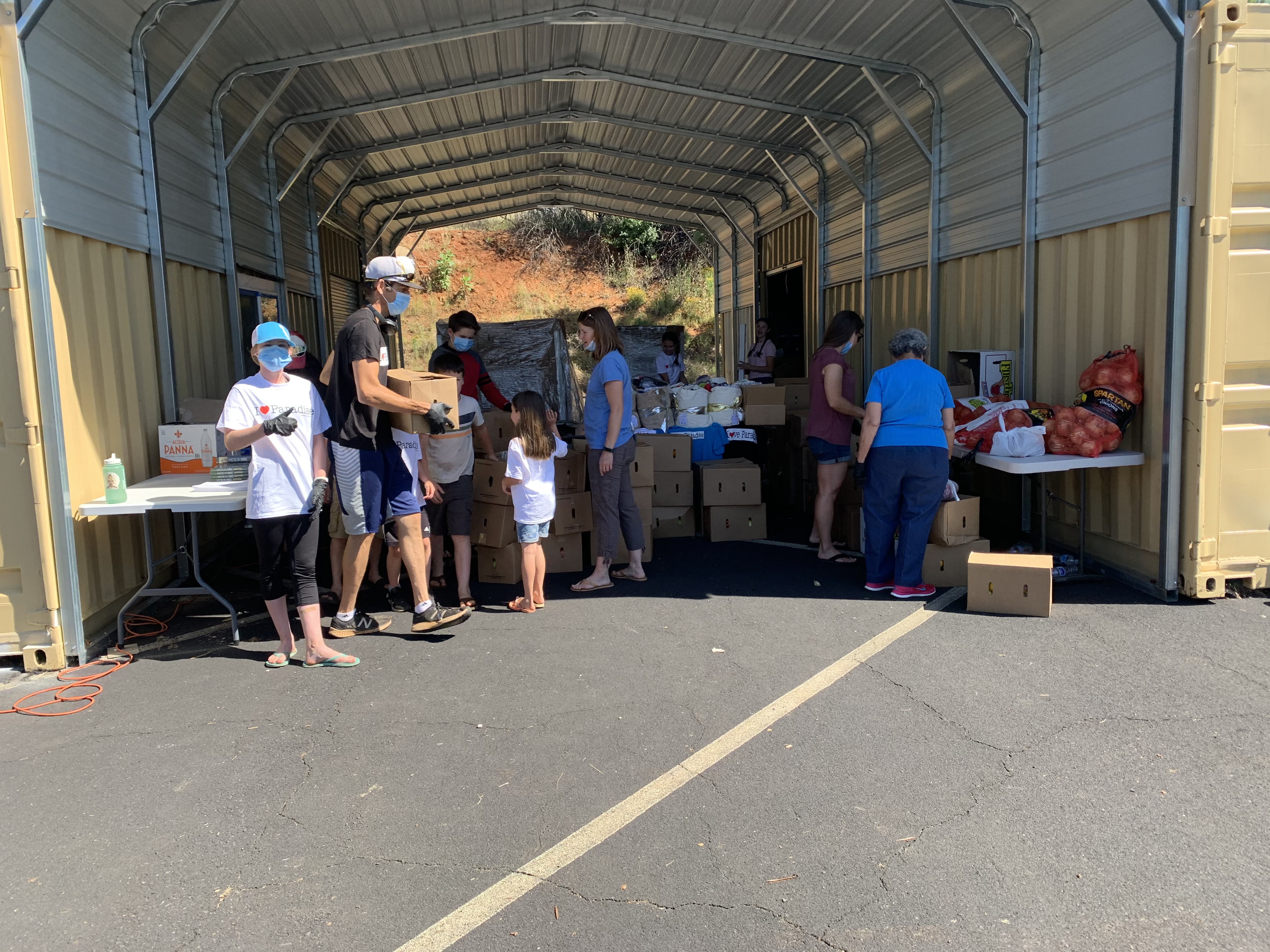 On Tuesdays, families work together filling and delivering boxes of food. Grateful to get out of the house at a safe outreach, they serve others each week during the COVID-19 shelter in place.  