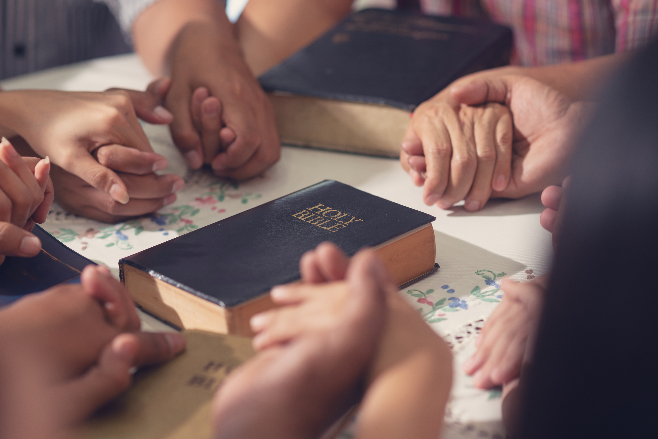 holding hands during Bible study