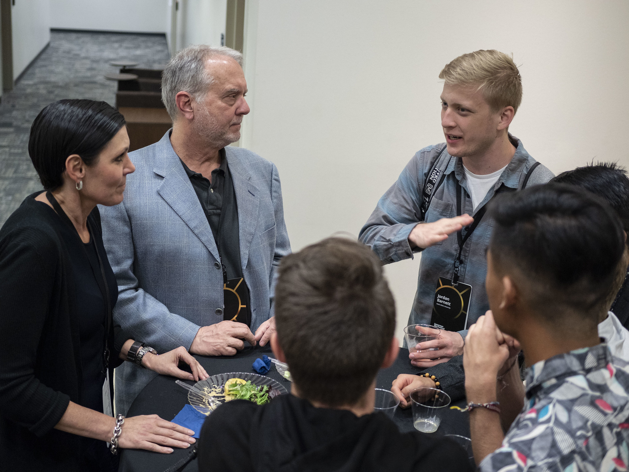 Tatia and Chris Cibelli, professional film editors, talk to student filmmakers during a meal break at the 2019 Sonscreen Film Festival.