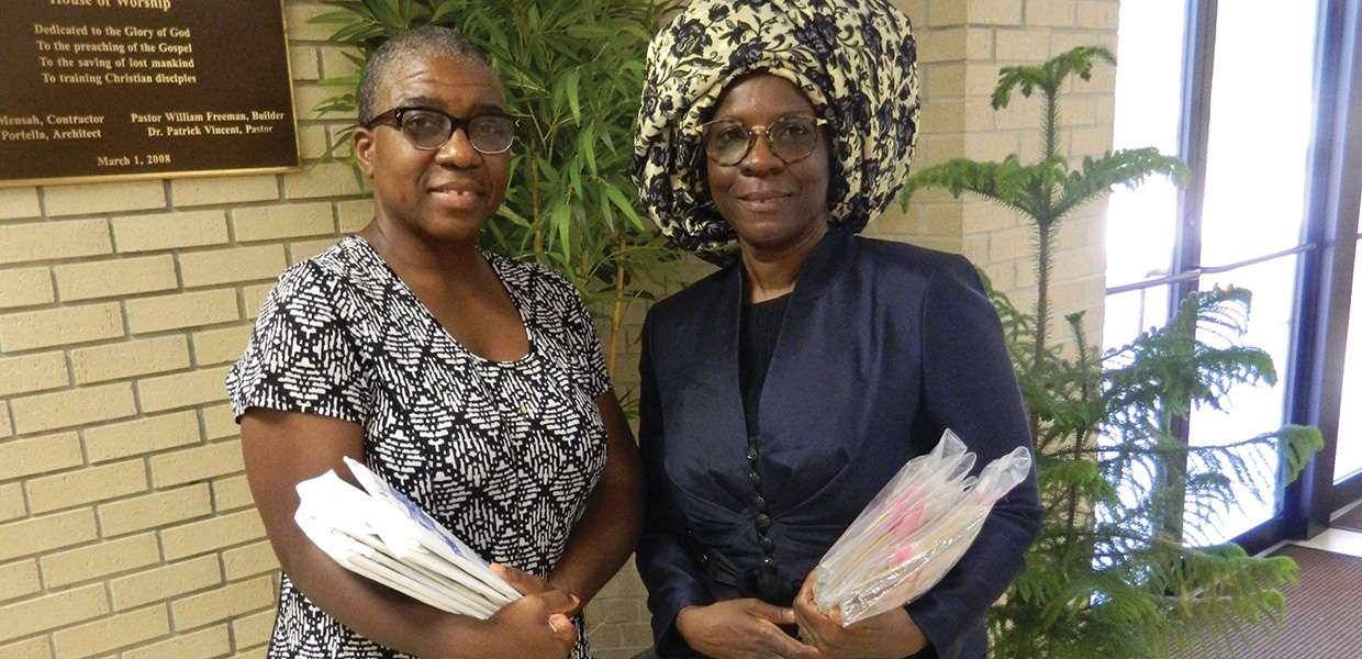 Peach Brooks (left) and Alethea Truman gather after canvassing the neighborhood before an afternoon Bible study. Their Bible study group is preparing candidates for baptism and nurturing new members. 