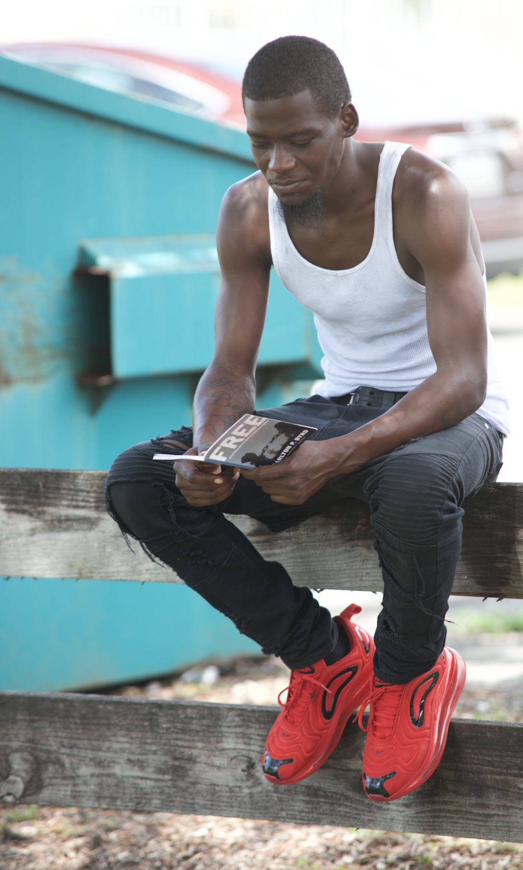 Community member in Miami-area reads a copy of FREE: Revisiting God’s Plan for Oppressed People, which was distributed by local church members. Photo courtesy of Breath of Life Ministries