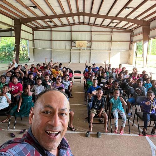 North American Division administrative team visits Guam-Micronesia Mission, group takes photo in GMM school gym