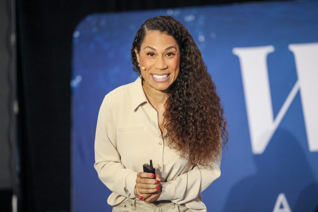 Close-up of a smiling woman preparing to speak 